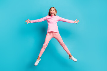 Poster - Full size photo of cool funky pretty teenager jump like star yell wear pink pants poloneck white footwear isolated on teal background