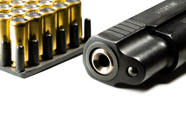 Legalization of weapons. The legal traumatic short-barrel weapon lies on a white background next to the cartridges