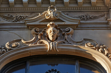Architectural detail of baroque facade with male head