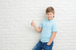 © yana_novak22 - Portrait of beautiful little boy giving you thumbs up over white background