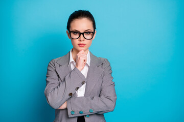 Sticker - Close-up portrait of attractive smart content businesslady thinking touching chin isolated over bright blue color background