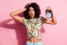 Portrait Photo Of Clueless Troubled Curly African Woman Showing Watch Late Grimacing Isolated On Pastel Pink Color Background