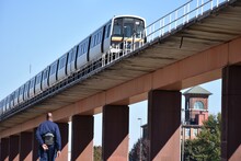 Mass Transit Train On An Elevated Track In The City