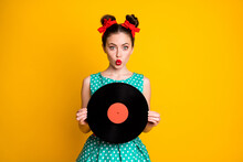 Portrait Of Pretty Lovely Amazed Girl Holding In Hands Vinyl Disc Pout Lips Isolated On Vivid Yellow Color Background