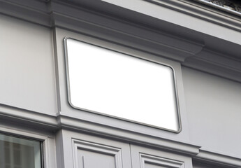 Wall Mural - Storefront on a grey shop frontage Mockup. Empty store brand signboard frame in street