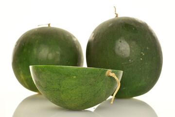 Ripe organic watermelons, close-up, on a white background.