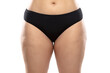 © master1305 - Front view. Overweight woman with fat cellulite legs and buttocks, obesity female body in black underwear isolated on white background. Orange peel skin, liposuction, healthcare and beauty treatment.