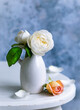 White roses in ceramic vase