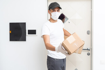 Sticker - Delivery man holding cardboard boxes in medical rubber gloves and mask. copy space. Fast and free Delivery transport . Online shopping and Express delivery . Quarantine