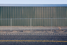 Corrugated Iron Building With A Fence, By Highway