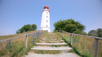 Canvas Print - lighthouse on a hill on the coast