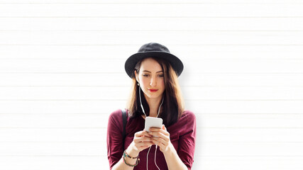 Poster - Woman listening to music from her phone