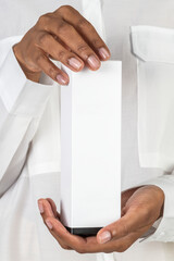 Poster - Hands holding a white blank cosmetic packaging