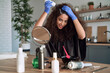 © gpointstudio - Woman dyeing her hair at home