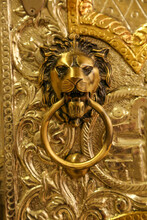Close-up Of An Golden Antique Metal With A Lion Face