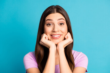 Sticker - Photo portrait of cheerful young lagy girl dressed casual violet outfit arms cheeks isolated blue color background