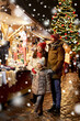 © Syda Productions - family, winter holidays and celebration concept - happy mother, father and little daughter at christmas market on town hall square in tallinn, estonia over snow