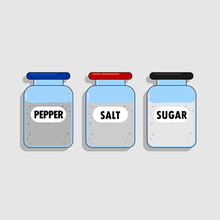 A Bottle Of Salt With A Red Cap. A Bottle Filled With Sugar With A Black Cap And A Pepper Bottle With A Blue Cap