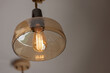 © Rattanachat - vintage light bulb on glass lamp. hanging glass lamp.