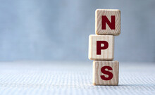NPS Word Concept On Wooden Cubes On Gray Background