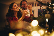 © Jacob Lund - Couple decorating Christmas tree
