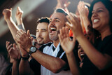 Group of soccer fans cheering their national team
