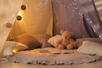 Poster - Play tent with books, pillows and Teddy bear. Modern children's room interior