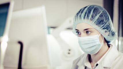Wall Mural - female scientist testing biohazardous samples, futuristic laboratory interior