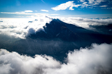 Wall Mural - Mountain peak above the clouds