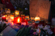 Hanau, Germany - February 20 2020: Flowers and Candles at the Hanau shooting site as a remembrance to the victims. Right extremism. Terror attack.