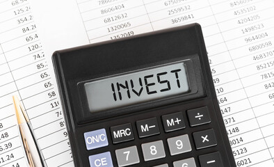 Calculator with the word INVEST on the display.