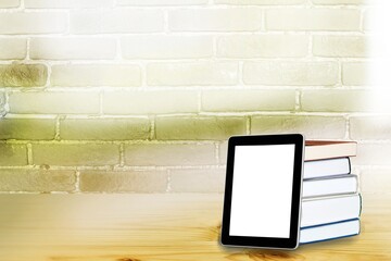 Wall Mural - Stack of books with modern digital tablet on table