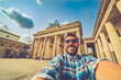 happy tourist man take selfie photo in Berlin city, Germany
