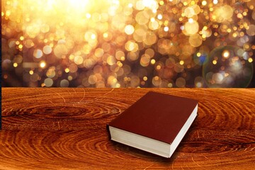 Wall Mural - open book on old wooden table.