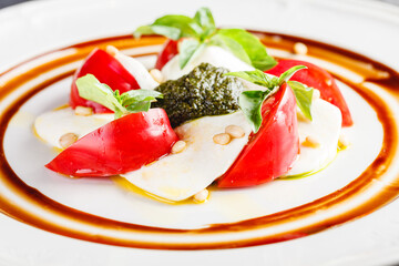 Wall Mural - Caprese salad with mozzarella, tomato, basil and pesto