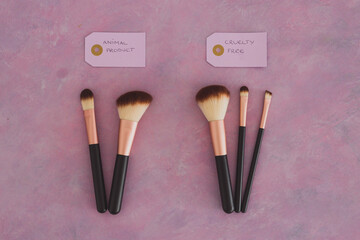 cruelty free vs animal products concept, sets of make up brushes with labels