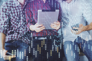 Double exposure of forex graph drawing and man and woman working together holding and using a mobile device. Trade concept.