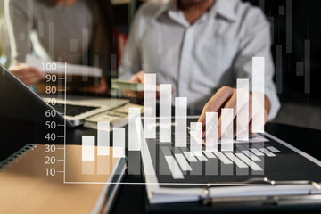 Wall Mural - Business documents on office table with smart phone and calculator digital tablet and graph .