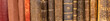 Row of old 100 years old books on a shelf.