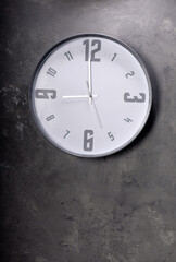 Poster - wall clock at concrete painted background