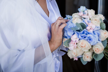 Canvas Print - bride in the morning in a negligee at the wedding