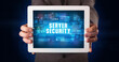 © ra2 studio - Young business person working on tablet and shows the digital sign: SERVER SECURITY