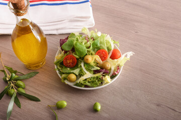 Wall Mural - Mediterranean salad on wooden kitchen bench elevated view