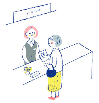 受付窓口　受付係の女性とシニア女性