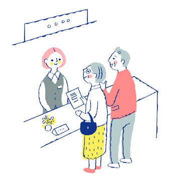 受付窓口　受付係の女性とシニア夫婦