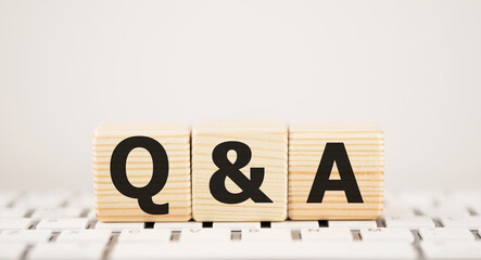 Wall Mural - Q A or Questions and answers on black block with keyboard background.