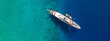 © aerial-drone - Aerial drone top down ultra wide photo of luxury yacht anchored in tropical exotic island turquoise sea