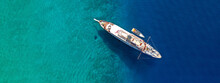 Aerial Drone Top Down Ultra Wide Photo Of Luxury Yacht Anchored In Tropical Exotic Island Turquoise Sea