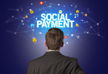 rear view of a businessman with social payment inscription, social networking concept