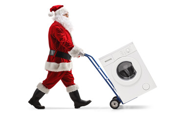 Poster - Santa claus pushing a washing machine on a hand truck